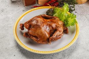 Baked small chicken with spices photo