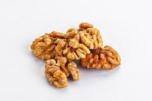 Cracked kernel walnut heap isolated photo