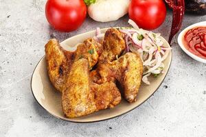 Grilled chicken wings with sauce photo