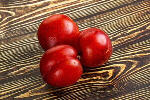 Ripe sweet juicy red plum photo