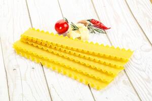 Uncooked raw Lasagna dry sheets photo