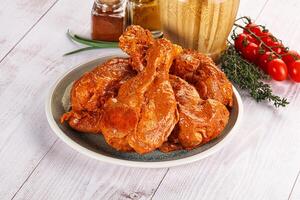 Raw turkey shoulder wing in Indian tandoori marinade photo
