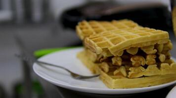Square waffles Belgian waffles close-up. Waffle texture or background. Viennese waffles close-up video