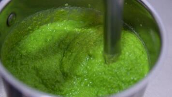 Puree mashed potatoes with green pea in bowl on wooden table plate of soup puree of green peas with mint on a table video
