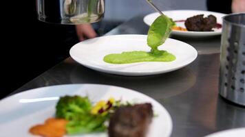 Puree mashed potatoes with green pea in bowl on wooden table. grilled salmon with mashed peas, Salmon steak, Red fish piece with green pea puree. healthy meal close up video