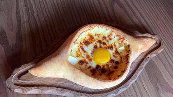 Directly above view of Khachapuri traditional Georgian pastry with cheese and egg video