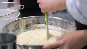 Batter Cake dough. Mixing cake batter in bowl in slow motion. video