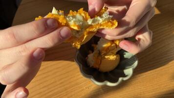 Break apart the macarons. Arrangement of pastel-colored macaroons on brown paper video