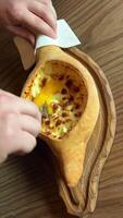 Directly above view of Khachapuri traditional Georgian pastry with cheese and egg video