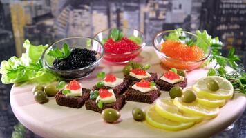 Sandwiches with caviar food background. several sandwiches with red caviar rotate on a plate. close-up. video