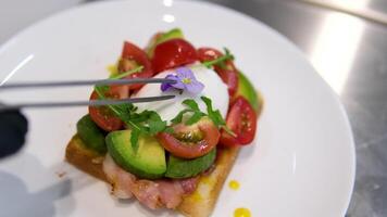 Egg benedict with hollandaise sauce and smoked salmon on toast Eggs Benedict with bread and tomato on a plate with becon morning sandwich video