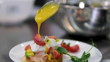 Egg benedict with hollandaise sauce and smoked salmon on toast Eggs Benedict with bread and tomato on a plate with becon morning sandwich video