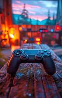 A game controller with a red light on it. The controller is on a wet surface photo