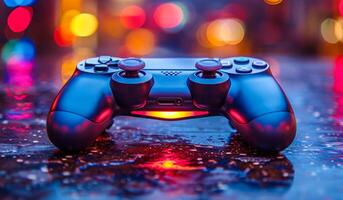 A game controller with a red light on it. The controller is on a wet surface photo