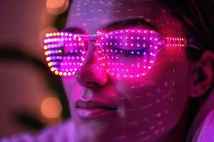 A woman with glow in the dark sunglasses and purple lights photo