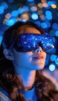 A woman is wearing a stylish pair of virtual reality goggles on her face photo