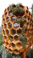 An Innovative Wooden Bee Habitat Design that Incorporates Greenery for Enhanced Aesthetics photo