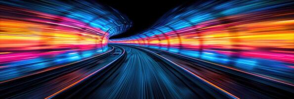A blurry picture of a train traveling through a tunnel at night photo
