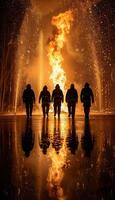 Brave firefighters are heroically combatting a blazing inferno during the dark night hours photo