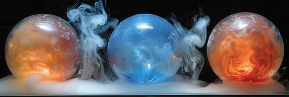 There are three balls on a table, and smoke is coming out of them photo