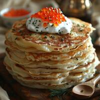 fried pancakes with red caviar photo