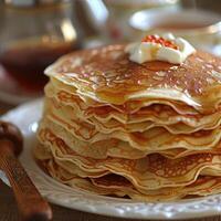 fried pancakes with red caviar photo