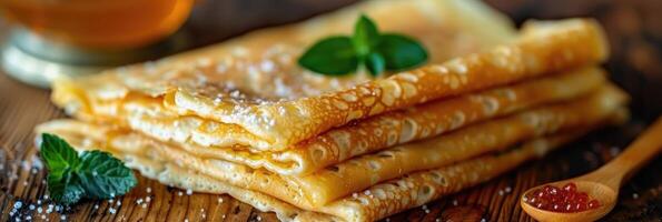 fried pancakes with red caviar photo
