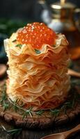 fried pancakes with red caviar photo
