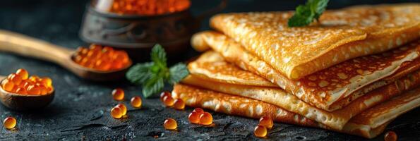 fried pancakes with red caviar photo