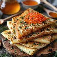fried pancakes with red caviar photo