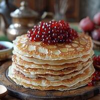 fried pancakes with red caviar photo