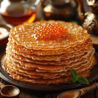 fried pancakes with red caviar photo