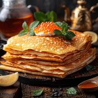 fried pancakes with red caviar photo