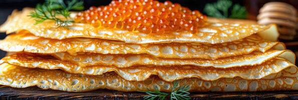 fried pancakes with red caviar photo
