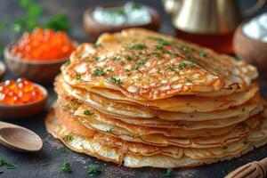 fried pancakes with red caviar photo
