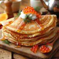fried pancakes with red caviar photo