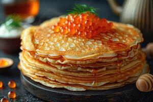 fried pancakes with red caviar photo