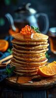 fried pancakes with red caviar photo