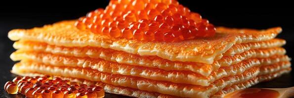 fried pancakes with red caviar photo
