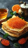 fried pancakes with red caviar photo