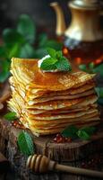 fried pancakes with red caviar photo