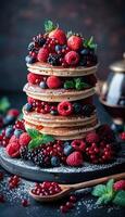 A towering stack of delicious pancakes topped with fresh berries photo