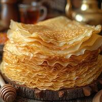 Close up of a delicious stack of pancakes topped with parsley photo