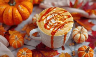 A creamy pumpkin spice latte with a drizzle of caramel photo