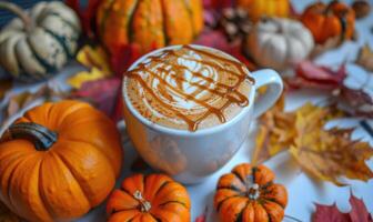 A pumpkin spice latte with a drizzle of caramel photo