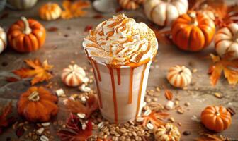 A pumpkin spice latte with a drizzle of caramel photo