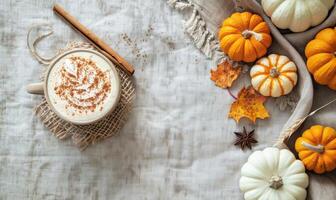 A pumpkin spice latte with a cinnamon stick photo