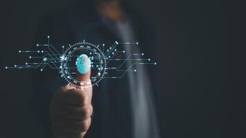 Businessman protecting personal data on finger print with virtual screen interfaces. Cyber security and privacy concepts to protect data. Lock icon and internet network security technology. photo