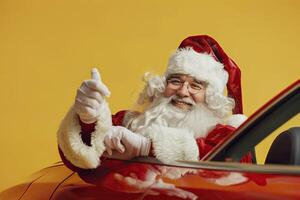 Santa claus driving car and showing thumbs up on yellow background. photo