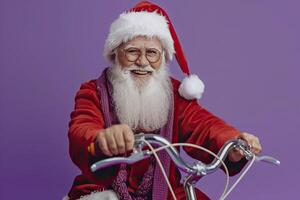 Santa Claus riding bicycle on purple background. photo